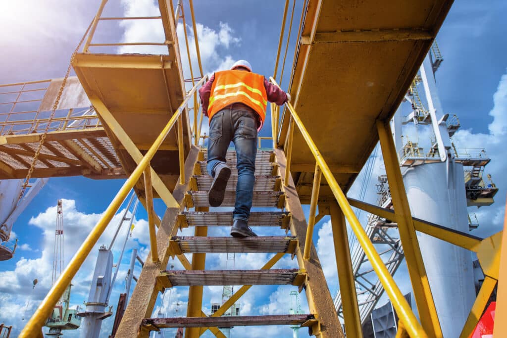 Workers walking up gangways